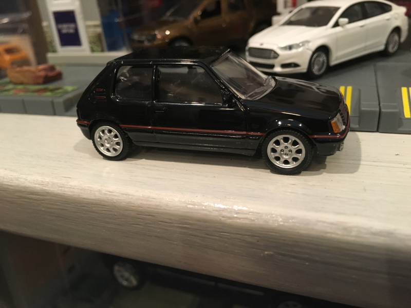 Illustration for article titled French Friday Norev Peugeot 205GTI 1:64 scale